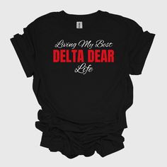 Living My Best Delta Dear Life, Delta Sigma Theta 1913 Unisex Softstyle T-Shirt, Sorority, Inc The unisex soft-style t-shirt puts a new spin on casual comfort. Made from very soft materials, this tee is 100% cotton for solid colors. Heather colors and sports grey include polyester. The shoulders have twill tape for improved durability. There are no side seams. The collar is made with ribbed knitting to prevent curling damage.  .: Made with 100% ring-spun cotton, a lightweight fabric (4.5 oz/yd² Delta Sigma Theta Shirt, Delta Sigma Theta Baseball Jersey, Delta Sigma Theta Apparel Shirts & Tops, Delta Sigma Theta Apparel Brothers And Sisters' Greek Store, Delta Sigma Theta T-shirts & Tank Tops, Delta Sigma Theta, Soft Style, Twill Tape, Shirt Price