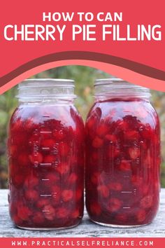 two jars filled with cherry pie filling sitting on top of a wooden table next to each other