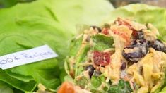 lettuce with black beans, tomatoes and other toppings on it next to a note that says 1004 recipes