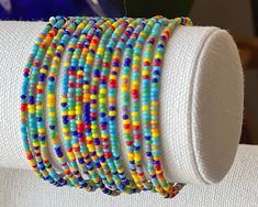 Add a pop of color to your wrist with this dainty, thin colorful seed bead bracelet, featuring a bright rainbow color mix, perfect for celebrating friendship and joy. *  Purchase multiples and save *  Made from tiny glass seed beads (2mm)  *  Available in multiple sizes *  Strung on durable beading elastic. *  Shipped to you in our recyclable packaging 🦋YOU MAY ALSO LIKE Daisy & Dahlia Bracelets https://etsy.me/4855PlF Seed Bead Bracelets https://bit.ly/stonesandpaper Tila Bracelets- https://et Tila Bracelets, Celebrating Friendship, Friendship Bracelets With Beads, Handmade Packaging, Seed Bead Bracelet, Bright Rainbow, Recyclable Packaging, Color Mix, Bracelet Beaded