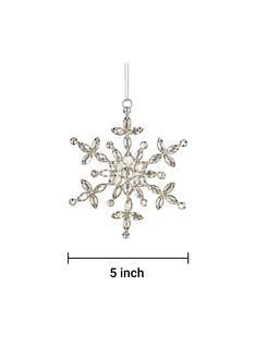 a snowflake ornament is shown with measurements for the size and shape