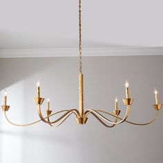 a gold chandelier hanging from the ceiling