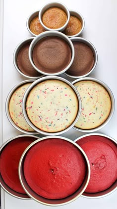 six tins filled with different types of cakes