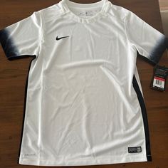 Boys Nike Brand Soccer Shirt. Size Is A Large Brand New With Tags. Color Is White With Black From A Smoke-Free Home. Nike White Sports Shirt, Nike Sporty White Shirt, Nike White Short Sleeve Shirt, Soccer Shirt, Nike Soccer, Nike Brand, Comfy Clothes, Cool Outfits For Men, Boys Nike