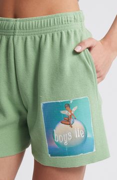 Love to lounge in these soft sweat shorts designed with a vibrant logo graphic. 4" inseam; 12 1/2" leg opening; 11 1/2" front rise; 13 1/2" back rise (size Small) Elastic waist Side-seam pockets 100% cotton Machine wash, tumble dry Imported Sweatpants With Built-in Shorts For Loungewear, Loungewear Sweatpants With Built-in Shorts, Short Length Sweatpants With Built-in Shorts For Loungewear, Green Athletic Shorts For Loungewear, Green Athletic Shorts For Loungewear And Athleisure, Green Athleisure Shorts For Loungewear, Green Athleisure Athletic Shorts For Loungewear, Green Pajama Shorts For Lounging, Relaxed Fit Shorts With Letter Print For Leisure