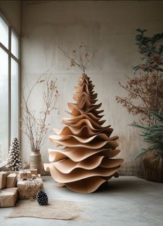 a large wooden christmas tree sitting next to a window