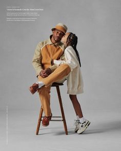 a man sitting on top of a stool next to a woman