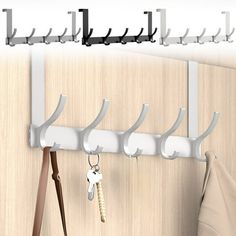 there is a coat rack with keys hanging on it