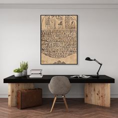 a desk with a chair next to it and a painting on the wall above it