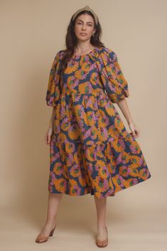 Brand: Moodie Puff sleeve midi dress with vibrant floral print. Dress has side pockets and an open back with tie. ♡ Details Color: Multi Puff sleeves Hidden side pockets Open tie back Partially lined 100% Cotton | Lining; 70% Polyester, 30% Cotton Hand wash recommended Sizing Model info: Height 5'3"| Bust 32D| Waist 25"| Hips 34" Model is wearing a size XS Fit: Relaxed fit Stretch: No stretch Measurements: XS: Bust = 35" | Waist = 34" | Length = 42.5" S: Bust = 36" | Waist = 35" | Length = 42.5" Tzniut Fashion, Gender Euphoria, Puff Sleeve Midi Dress, Spring 23, Dress Inspo, Sleeve Midi Dress, 5 S, Clothes Horse, Midi Length Dress