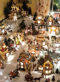 a christmas village is shown in the middle of a living room