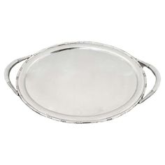 an oval silver tray with handles