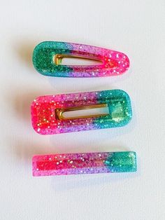 Adorable handmade resin hair clip. Perfect to clip into a bun, above a messy pony, or just to pull hair back from your face. The listing is for one hair clip. Choose which style you like best between bar, rectangle, and duckbill.  Mermaid inspired teal, pink, and purple ombre look. Clips are made to order, so each clip is unique and will vary a bit from the picture.  Please note, these clips are a bit heavier than your average hair clip, so they work best on thick hair and/or sitting above a bun or ponytail. Recommended for ages 3+. Messy Pony, Mermaid Glitter, Mermaid Inspired, Resin Ideas, Hair Back, Resin Projects, Purple Ombre, One Hair