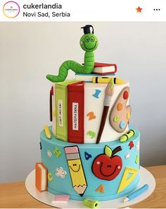 there is a cake that looks like it has books and pencils on the top