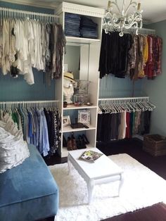 the closet is organized with clothes, shoes, and other things to wear in it