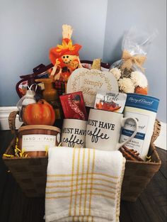 a basket filled with lots of goodies sitting on top of a wooden floor