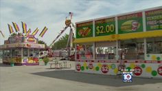 an amusement park with carnival rides and food carts