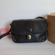 "Vtg Classic Coach Glenwood Shoulder Bag Bag Black pebbled leather with brass hardware Roomy lined interior with inner zip pocket, and a center divider Covered by a flap and secured with a turnlock Full back slip pocket Original hangtag and chain Adjustable 47\" strap Strap drop: 19\"-21\" Measures: 12\"L, 8\"H, 2.5\"W Made in the United States Original box included Cleaned, conditioned and ready to wear! Questions? Just ask More vtg coach styles/colors also available" Coach Vintage Handbags, Leather Patterns, Accessories Inspiration, O Bag, Vintage Coach Bags, Thrift Finds, Leather Pattern, Jewelry Outfit, Vintage Coach