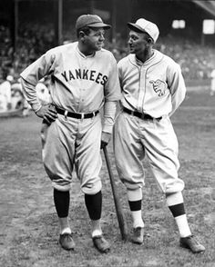 two baseball players standing next to each other