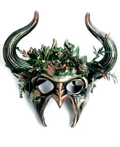 Adorned with exquisite detailing and forest foliage, this mask exudes the aura of a woodland creature. The majestic ram horns add an element of power and mystique to your goblin persona. Designed for comfort and durability, it ensures you can revel in your mystical character all night long at masquerade events, Halloween parties, and other special events!


Age Group/Gender - Adult/Men

Size/Type - One size fits all adults

Mask Color - Green/copper

Mask Material - Polyresin

Accent Material - Forest Masquerade, Mask Ball Party, Masquerade Mask Black, Masquerade Ball Masks, Jester Mask, Mask Ball, Mens Masquerade Mask, Devil Mask, Ball Mask