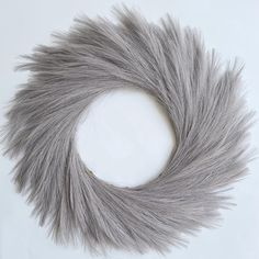 a gray furry circle on a white background with clippings to the center and bottom