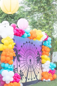 Ombre ferris wheel backdrop with white, blue, pink, orange, and yellow balloons. Hanging lanterns and bistro string lights, festival birthday party, festival theme, boho festival, festival birthday, sweet 16 birthday, 16th birthday ideas, sweet 16, scottsdale arizona Coachella Backdrop Ideas, Coachella Pool Party Decor, Bachella Theme Party, Coachella 30th Birthday Party, Ferris Wheel Decorations Party Ideas, Ferris Wheel Backdrop, Festival First Birthday Party