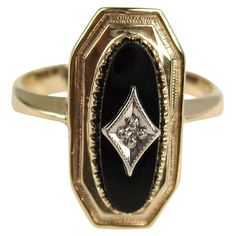 This beautiful ring contains a center oval black onyx that contains a white gold plaque in a diamond shape that contains an old mine cut diamond. The ring is a 10.5 and can be sized by us or your jeweler. Be sure to check our storefront for hundreds of pieces of Fine, costume jewelry, sterling silver, and vintage clothing! Any questions please call, email or hit contact. Thanks! Antique Onyx Ring, Vintage Onyx Ring, Onyx Rings, Graduation Ring, Gothic Engagement Ring, Graduation Rings, Purple Stone Rings, Onyx Engagement Ring, Heirloom Jewelry