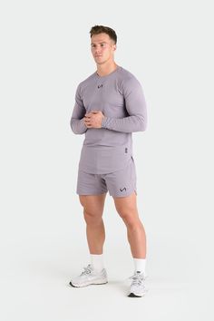 Introducing the long sleeve rendition of our Micro Mesh Tee - a fusion of style and functionality for those who demand peak performance from their gym-wear. Crafted to enhance your physique, this long sleeve gym tee boasts raglan sleeves, along with curved front and back hems, ensuring a fit that moves with you seamlessly from the gym to the streets. Engineered with our signature Micro Mesh DNA™, it not only enhances breathability and moisture-wicking but also embodies a modern aesthetic. Gray Technical Long Sleeve Activewear, Technical Gray Long Sleeve Activewear, Gray Long Sleeve Activewear For Training, Technical Long Sleeve Workout Activewear, Running Long Sleeve Top With Thumbholes, Running Tops With Thumbholes And Long Sleeves, Technical Long Sleeve Activewear For Gym, Technical Long Sleeve Moisture-wicking Activewear, Gray Athletic Fit Long Sleeve Activewear