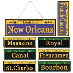 a sign hanging from the side of a building that says, new orleans magazine royal canal french bourbon