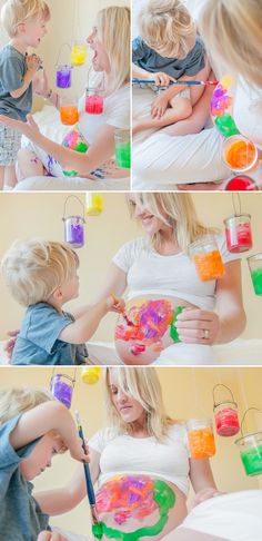 a mother and her son are playing with paint