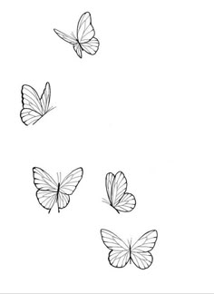 three butterflies flying in the air with one on its back and one on its side