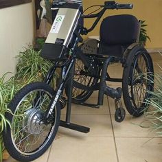 a wheelchair is parked next to some plants