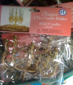 two tier candelabra in plastic packaging for sale at a store with price tags