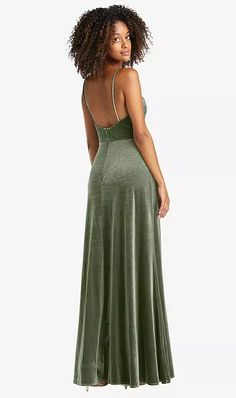 a woman in a green dress looking back