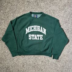 Vintage 90s Michigan State College University Spell Out Embroidered 1990s Streetwear Green Crewneck Sweatshirt Extra Large Mens Condition:  Good Used Measurements: Shown In Photos Above 90s Style Tops With Embroidered Logo For Streetwear, 90s Style Tops With Ribbed Cuffs For College, Green Crew Neck Top For Campus, 90s Streetwear Tops With Embroidered Logo, 90s Crew Neck Top With Embroidered Logo, Vintage Sweatshirt With Embroidered Logo For College, 90s Embroidered Logo Tops For Streetwear, 1990s Streetwear, Green College Sweatshirt