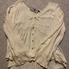 Nwt - Never Reached For This Shirt So It’s Time For A New Home. :) Beautiful Cream Color. Make Offers! Pet Friendly Home Casual Long Sleeve Cream Peasant Top, Casual Cream Flowy Tops, Flowy Cream Casual Tops, Flowy Button-up Top For Spring, Casual Button-up Top With Lace Trim, Casual Button-up Blouse With Lace Trim, Cream Long Sleeve Flowy Top, Casual Flowy Cream Blouse, Casual Cream Flowy Blouse