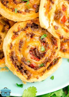 some tasty looking pastries on a plate with cilantro and parsley