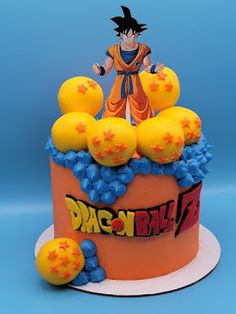 a dragon ball cake with yellow and blue decorations