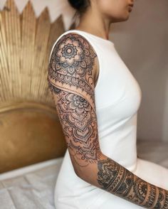 a woman with a tattoo on her arm