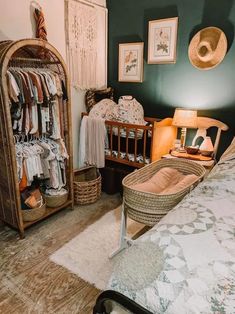 a baby crib in the corner of a room next to a bed and dresser