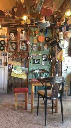 a room filled with lots of assorted items and decorations on the wall above it