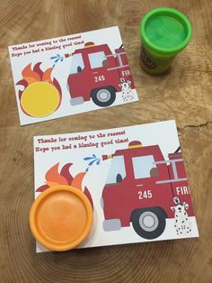 two firetruck birthday cards and a cup of coffee on a wooden table top