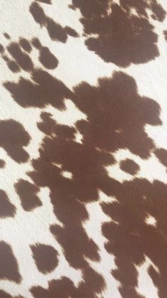 an animal print pattern is shown in brown and white colors on a leather material background