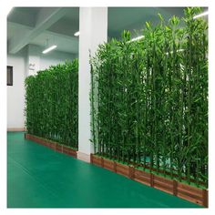 an office building with green plants growing on the walls and flooring in front of it