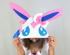 This Sylveon dress is extra cute! It can be made with the regular pink color scheme, or with a Shiny color scheme! It comes with bright pink pockets, and a little tail. This handcrafted dress is perfect for a casual cosplay, geeky parties and events, or for snuggling up at home! This custom item is made with high-quality anti-pill fleece, and it can be made to your measurements! (Please specify your bust/waist/hip measurements and height in the comments when ordering.) All dresses are equipped w Cheap Fitted Cosplay Costume, Cheap Character Print Cosplay Costumes, Kawaii Pink Cosplay Costume For Halloween, Pink Kawaii Cosplay Costume For Halloween, Pink Harajuku Style Costume For Costume Party, Pink Harajuku Cosplay Costume For Halloween, Pink Harajuku Cosplay Costume For Costume Party, Pink Harajuku Cosplay Costume, Pink Harajuku Style Cosplay Costume