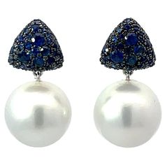 18 Karat White Gold drop earrings featuring two South Sea Pearls measuring 12-13 MM and 76 blue Sapphires weighing 1.33 Carats. Pearls earrings can be changed to Tahitian, Pink, Gold or South Sea DM for more videos and pictures on my ear. Search Harbor Diamonds Blue Pearl Earrings Fine Jewelry For Formal Events, Blue Pearl Earrings For Formal Occasions, Blue Pearl Earrings For Formal Events, Luxury Blue Drop Earrings, Luxury Blue Pearl Earrings For Anniversary, Luxury Formal Sapphire Earrings, Luxury Sapphire Earrings For Formal Occasions, Luxury Blue Gemstone Pearl Earrings, Luxury Blue Pearl Drop Earrings