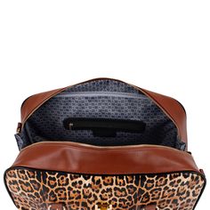 Combine fashion and functionality with this faux leather weekender bag.     Product features: Printed faux leather body Top turn-lock closure Lined interior with BM monogram and interior organizational pockets. Shiny gold logo plate and hardware Exterior zippered rear pocket  PU rolled handles and removable and adjusta Rectangular Luggage With Detachable Strap For Weekend Trips, Large Capacity Leopard Print Shoulder Bag For Travel, Travel Leopard Print Shoulder Bag, Leopard Print Large Capacity Shoulder Bag For Travel, Brown Luggage With Zipper Closure For Weekend Trips, Brown Rectangular Luggage With Detachable Strap, Leopard Print Travel Tote Bag, Leopard Print Large Capacity Travel Bag, Leopard Print Travel Bag With Large Capacity