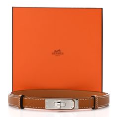 This is an authentic HERMES Epsom Kelly Belt in Gold. This stylish belt is crafted of Epsom calfskin leather in golden brown. This belt features a polished palladium silver Kelly turn lock plate and a discreet sliding system that allows the belt to be worn low at the hips or on the waist. Belt Gold, Golden Brown, Calf Skin, Turn Ons, Silver, Leather, Gold