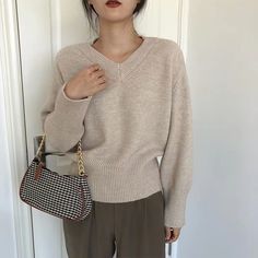 Vintage Solid Color V-Neck Sweater Trendy V-neck Solid Color Sweater, Trendy Solid Color V-neck Sweater, Trendy V-neck Sweater In Solid Color, Trendy Solid Color Sweater For Work, Trendy Khaki Winter Sweater, Basic Fall Sweater, Trendy Khaki Sweater For Spring, Casual Solid Color Spring Sweater, Basic Plain Sweater For Fall