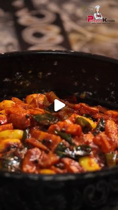 a pan filled with food sitting on top of a table